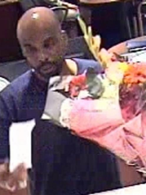 This security photo provided by the New York Police Department shows a man police say robbed a...