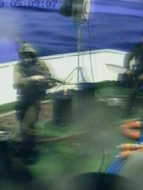 This video image released by the Turkish Aid group IHH show Israeli soldiers aboard a military...