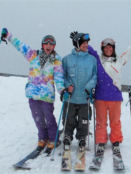 Three happy skiers welcome snow at the Treble Cone skifield on Saturday. From left are Kirsty...