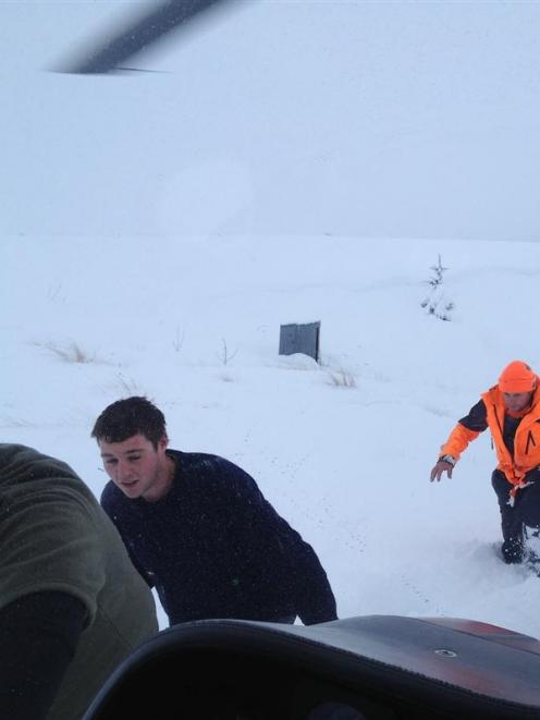 Three hunters snowed in at a hut near Lake Onslow, at Millers Flat, for three days  were ''hugely...