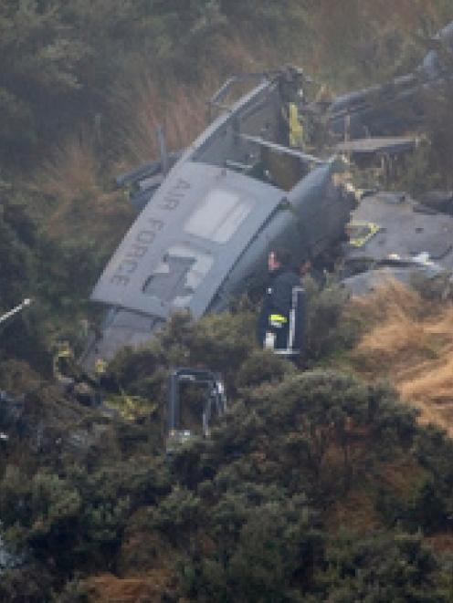 Three men died and one was seriously injured when the RNZAF Iroquois helicopter crashed near...