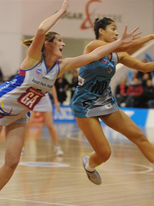 Thunderbirds wing defence Mo'onia Gerrard snares the ball ahead of Steel goal attack Donna...