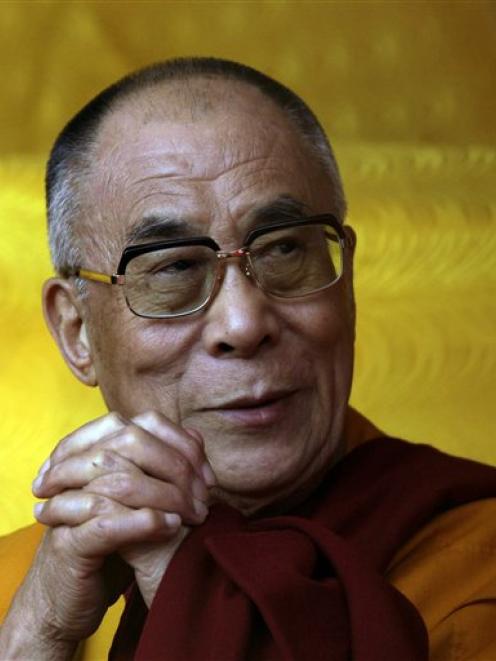 Tibetan spiritual leader the Dalai Lama looks on during a public meeting in Tawang, near the...