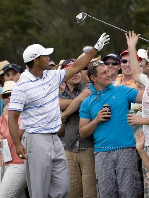 Tiger Woods has his club handed back by spectators after he bounced his driver so hard into the...