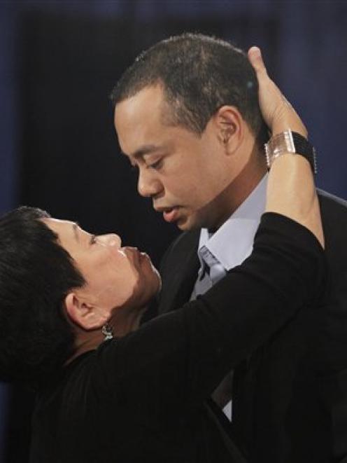 Tiger Woods, hugs and kisses his mother, Kultida Woods, during today's news conference. (AP Photo...