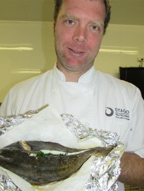 Tim Lynch and his freshly caught and cooked flounder. Photo by Pene Spencer.