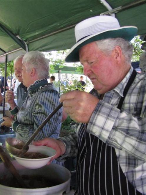 Tim Scurr ladles rabbit stew at the annual Cardrona vintage fair yesterday. Photos by Marjorie Cook.