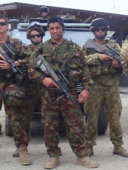 Trooper Lundon Williamson (centre) with other members of the New Zealand Defence Force serving in...