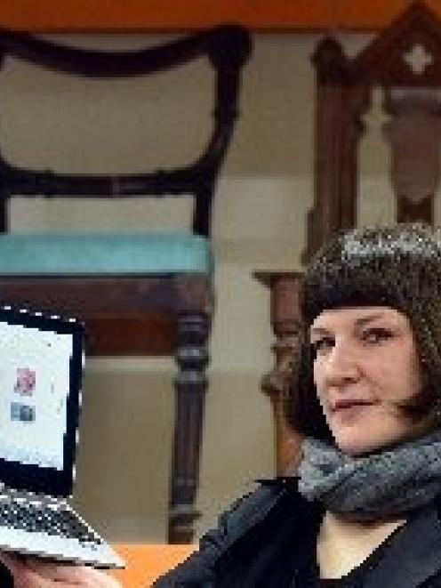 Toitu Otago Settlers Museum collections manager Kiri Griffin displays the digital archive in...