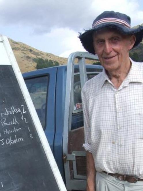 Tokarahi Collie Club life member Keith Sutherland checks entries in the long head section. Photo...