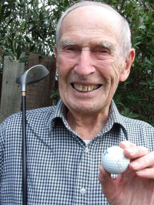 Tom Landreth with his ''lucky'' club. The ball used for his hole in one will be turned into a...