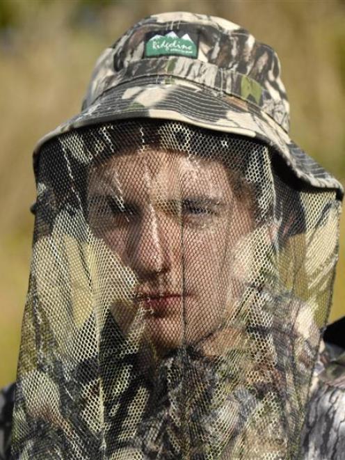 Tom models Ridgeline veiled cap in Buffalo camo print ($30)  from Centrefire McCarthys Stream and...
