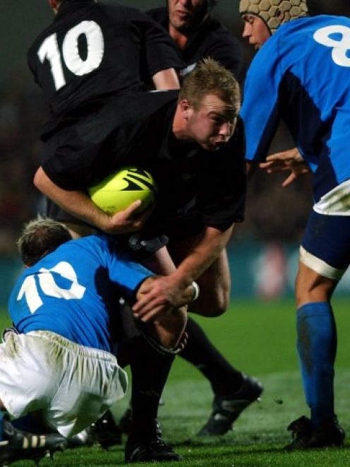 Tom Willis runs the ball up for the All Blacks against Italy during their test at Waikato Stadium...