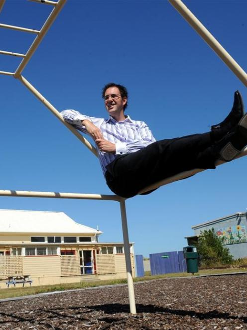 Tomahawk School principal Richard Aitken relaxes on his first day heading a school with no pupils...