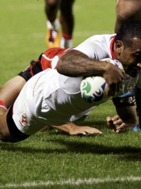 Tonga's Fetu'u Vainikolo scores a try during their Rugby World Cup Pool A match against Japan at...