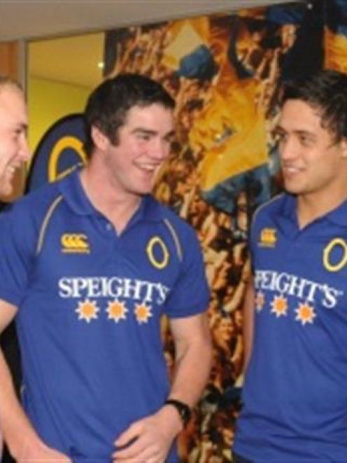 Tony Brown (right) talks with players (from left): Matt Faddes, Adam Hill and Lee Allan at the...