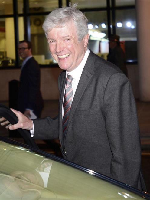Tony Hall, who has been appointed director general of the BBC, smiles as he leaves New...