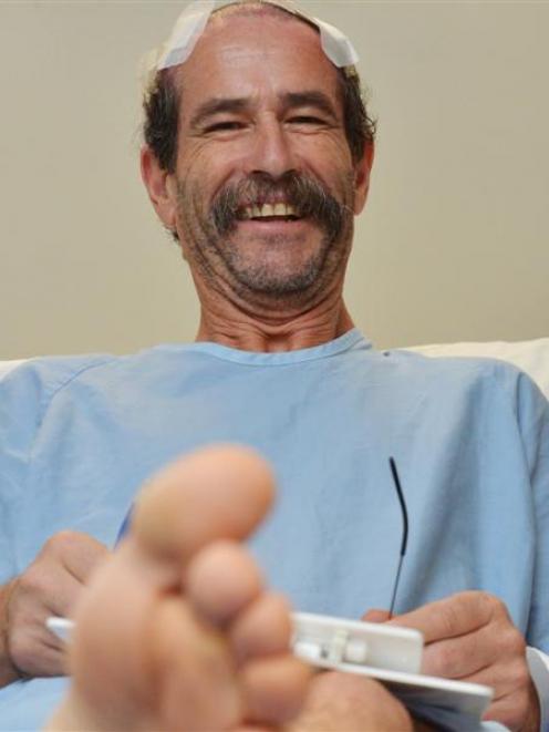 Tony van Kempen fills in some ACC forms before leaving Dunedin Hospital last week. He is now...