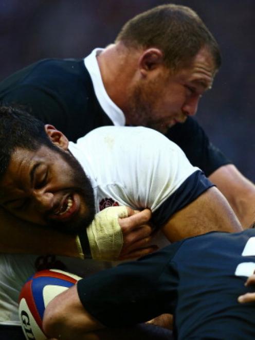 Tony Woodcock tackles England's Billy Vunipola. Photo Getty Images