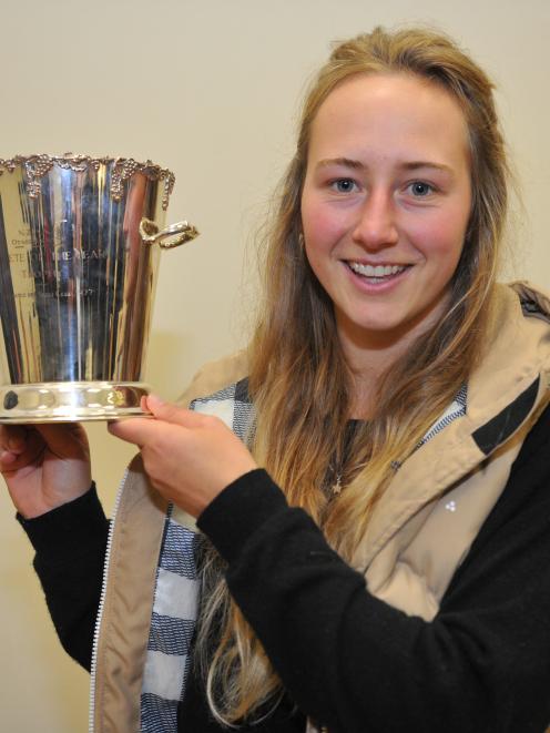 Tori Peeters with the Athletics Otago athlete of the year trophy she was presented with at a...