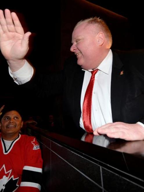 Toronto Mayor Rob Ford celebrates Canada's first goal against Team USA during their men's ice...