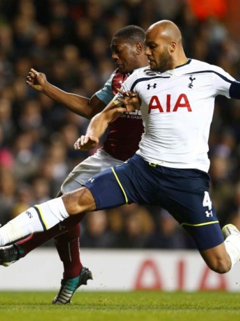 Tottenham Hotspur's Younes Kaboul challenges Burnley's Marvin Sordell during their FA Cup third...