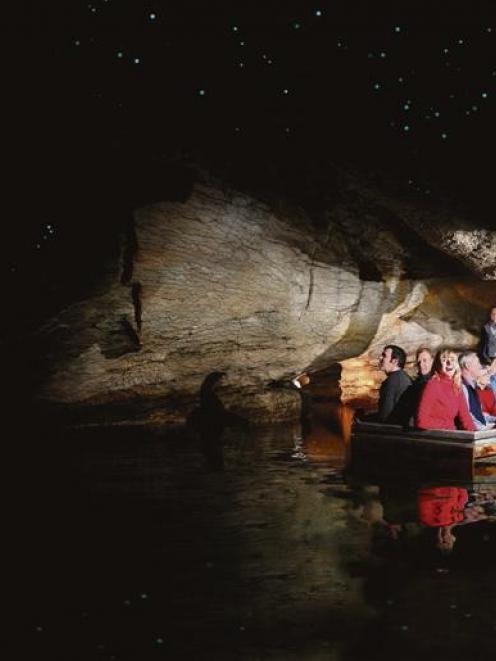 Tourists marvel at the glow-worms in a cave near Te Anau. Photo supplied.