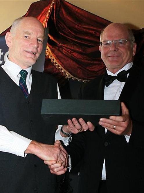 TracMap managing director Colin Brown (left) is congratulated by Civil Aviation Authority...