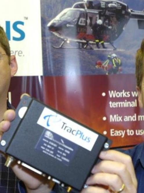 TracPlus US president Harlan Hamlin (left), holds a TracPlus antenna, and chief executive Chris...