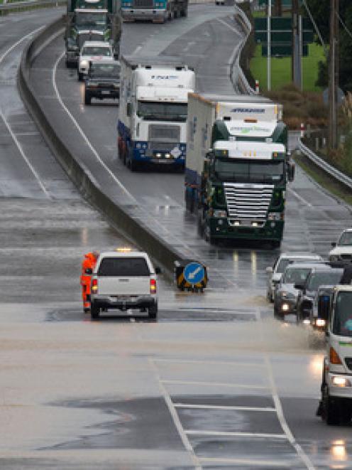 Traffic negotiating flooding on State Highway One between Waikanae and Paraparaumu. Photo NZ Herald.