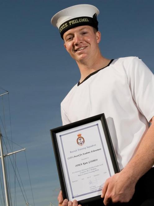 Trainee Navy diver Benjamin Ryan, of Dunedin, with his award for achieving top marks in academic...
