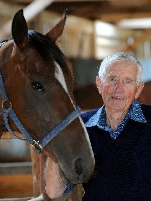 Trainer Brian Anderton, of North Taieri, stands with Blossom Festival, a 4-year-old mare about to...