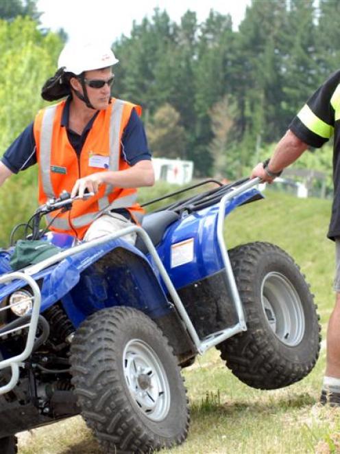 Trainers John Polstra (on quad bike), of Ag Challenge,  and Andrew Simpson, of CARNZ Training,...