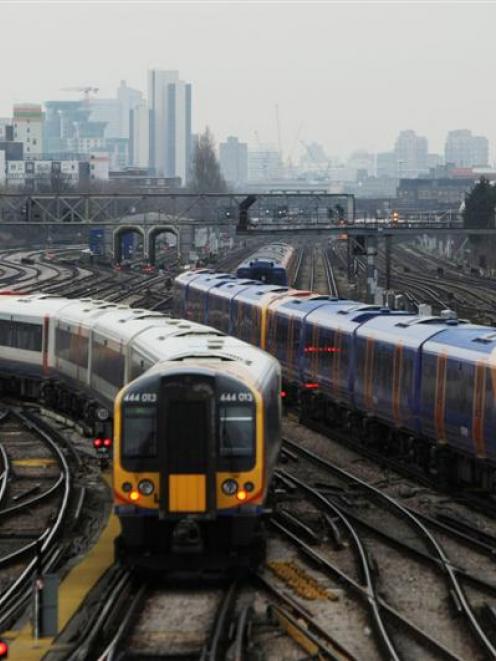 Trains seen from Clapham Junction station in London. Photo Matt Dunham/AP.