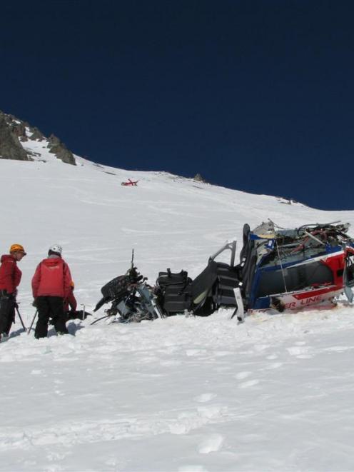 Transport Accident Investigation Commission investigators inspect the crash scene on Mt Alta on...