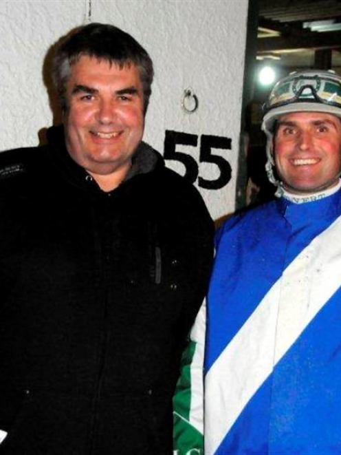 Trevor Casey (left) the owner of Escapee and driver Blair Orange at Forbury Park last night....