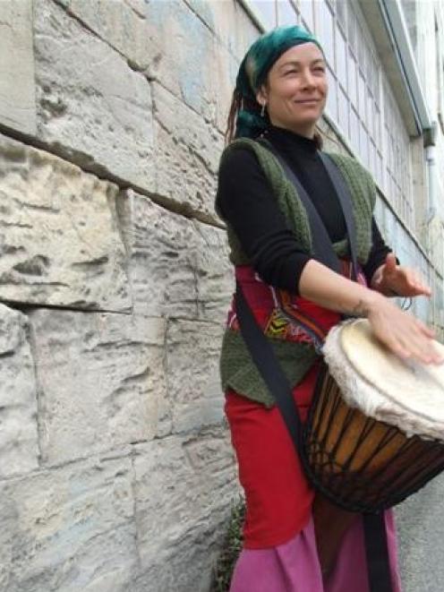 Tribal dance enthusiast Ra McRostie is busking to raise money for a trip to Africa. Photo by...