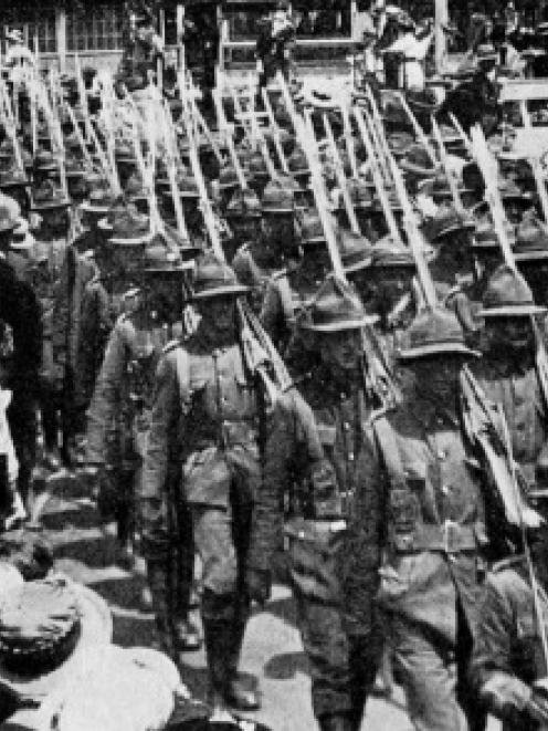 Troops passing through Cathedral Square during a route march through Christchurch by the 8th...