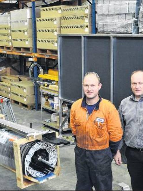 Tru-Bilt employee Steve Weller (left), with brothers Paul, Mark and Scott Taylor in the company's...