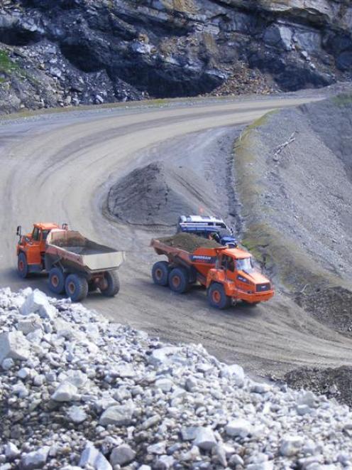 Trucks work at Bathurst Resources' Cascade mine last month, an operation it purchased as a going...