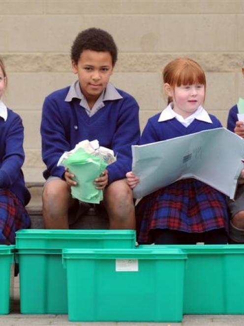 Trying out their new recycling bins courtesy of the Paper 4 Trees programme are St Joseph's...