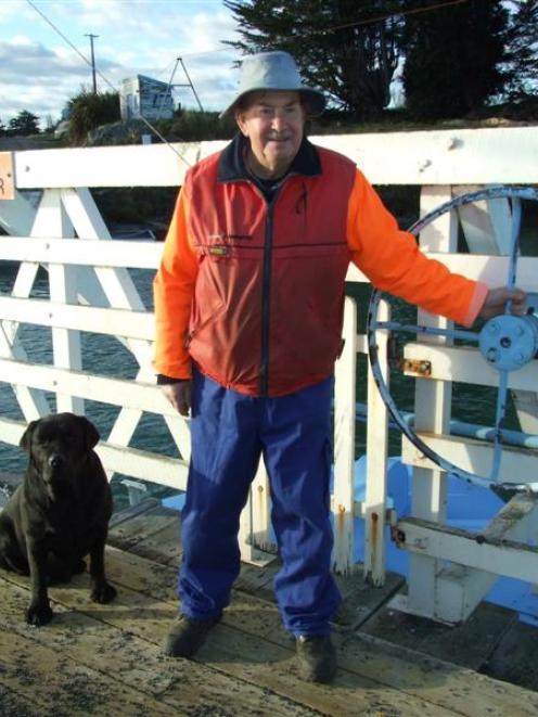 Tuapeka Punt operator Peter Dickson, with his dog Mission (7), has been ferrying people and cars...