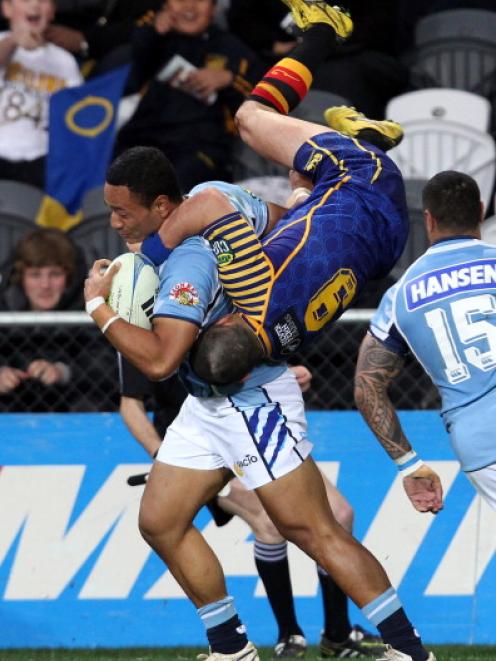 Tui Faasisila of Northland is tackled by Fumaki Tanaka of Otago. Photo by Rob Jefferies/Getty Images