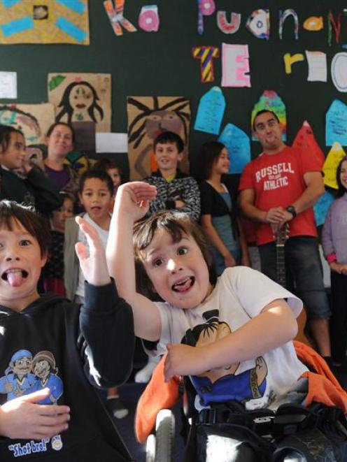 Tumai Cassidy (8, left), and Kiringaua Cassidy (6) participate in a Ka Puanani o Te Reo class at...