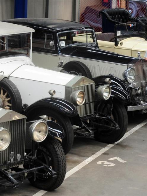 Turners Auctions Dunedin branch manager Andrew Spiers with a row of vintage Rolls-Royce cars,...