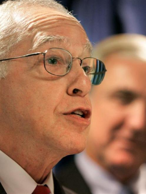 U.S. Attorney General Michael Mukasey, left, faces reporters as Michael Sullivan, U.S. attorney...