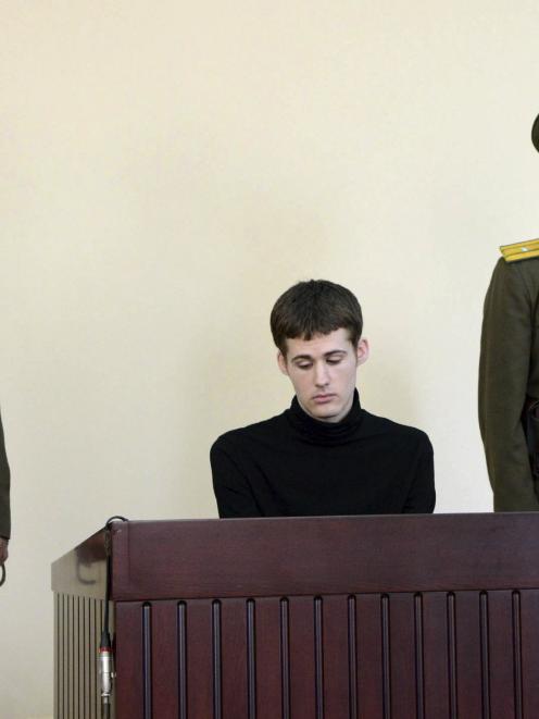 U.S. citizen Matthew Todd Miller sits in a witness box during his trial at the North Korean...