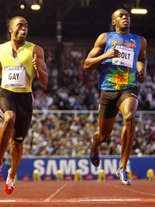 U.S. sprinter Tyson Gay, left, beats Jamaican Usain Bolt in the 100m race during the Diamond...