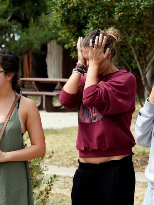 UC Santa Barbara students react near the scene of the shooting in the Isla Vista section of Santa...