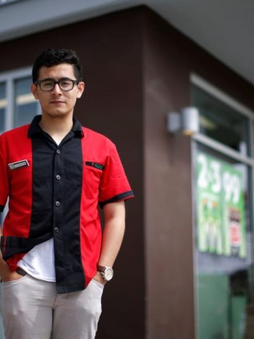 UCSB student and 7-Eleven employee Jorge Anaya stands outside the Isla Vista store where he saved...